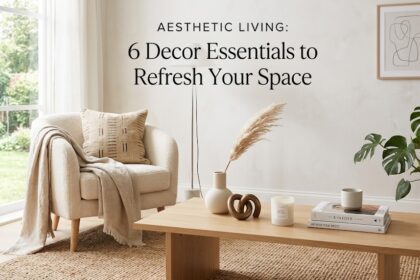 A beautifully styled living room featuring textured throw pillows, symmetrical ceramic table lamps, and delicate cherry blossom branches arranged in a tall floor vase.
